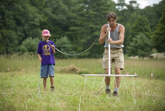 Urine solution application by Konrad Scheltema and his son during field trials. Photo by Rich Earth Institute.