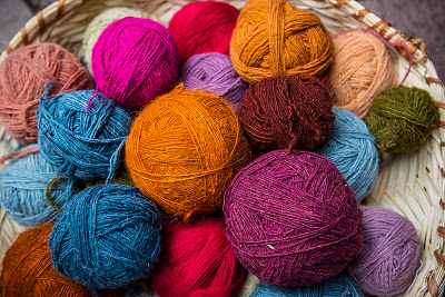 Balls of wool, or yarn, dyed with natural dyes, in Pisac Market, Peru.